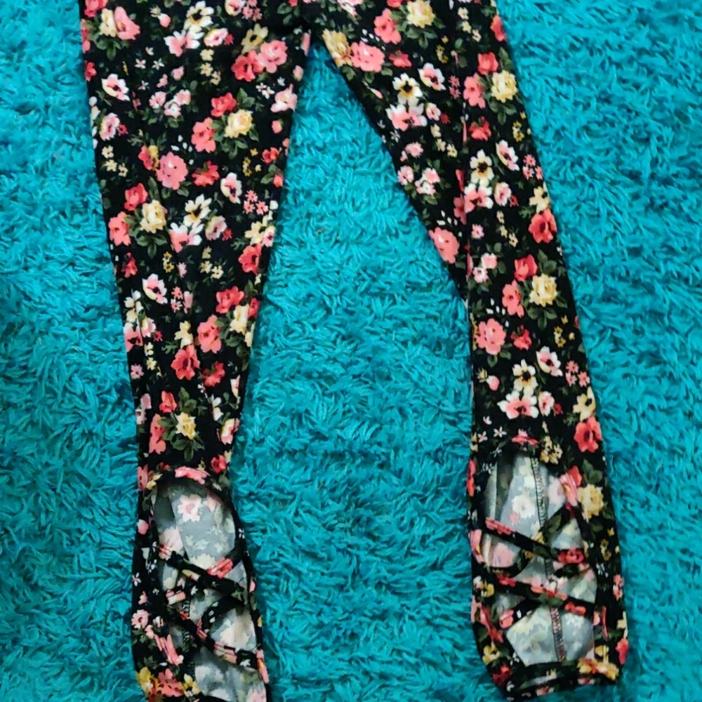 Black colorful pants with cutouts near the ankle